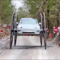 tesla with 10ft buggy wheels.mp4